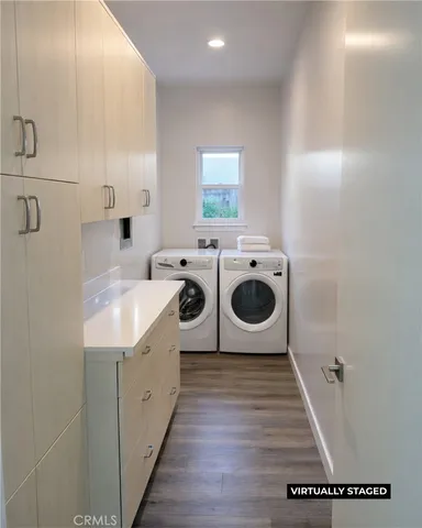a kitchen with a sink a stove and cabinets