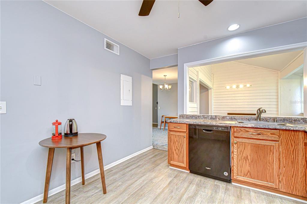 13402 Pinelake Way, Unit 202B Tampa, FL 33618 - Photo 22 of 42 a kitchen with stainless steel appliances granite countertop a stove and cabinets
