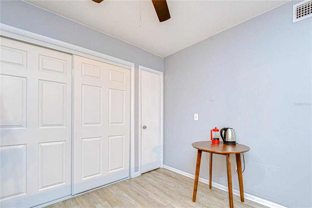 13402 Pinelake Way, Unit 202B Tampa, FL 33618 - Photo 23 of 42 a workspace room with furniture and wooden floor