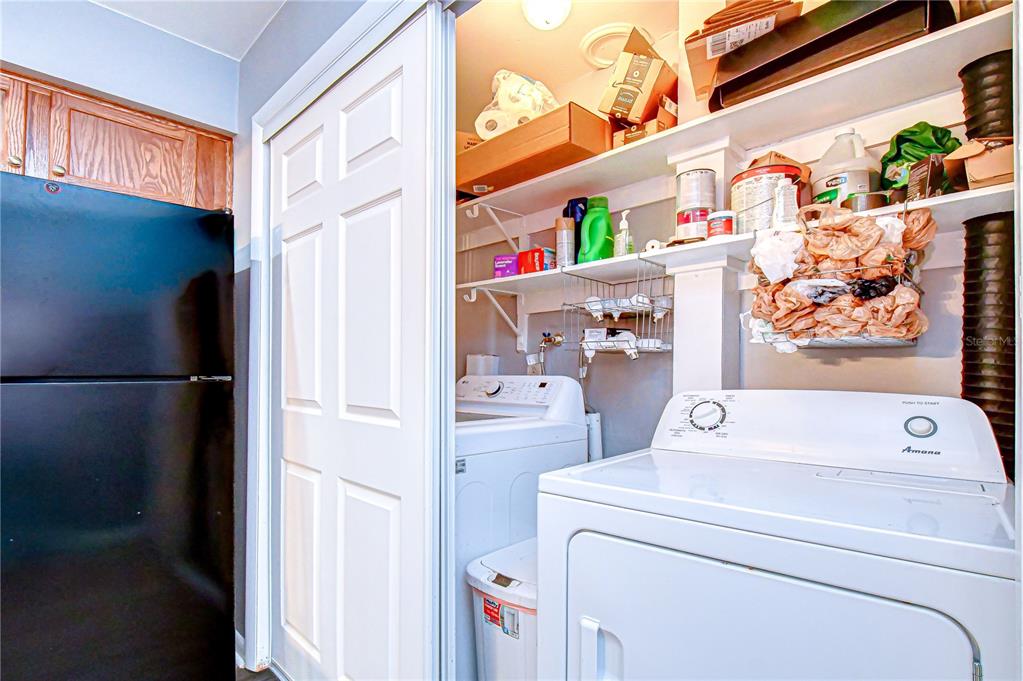 13402 Pinelake Way, Unit 202B Tampa, FL 33618 - Photo 24 of 42 a utility room with dryer and washer