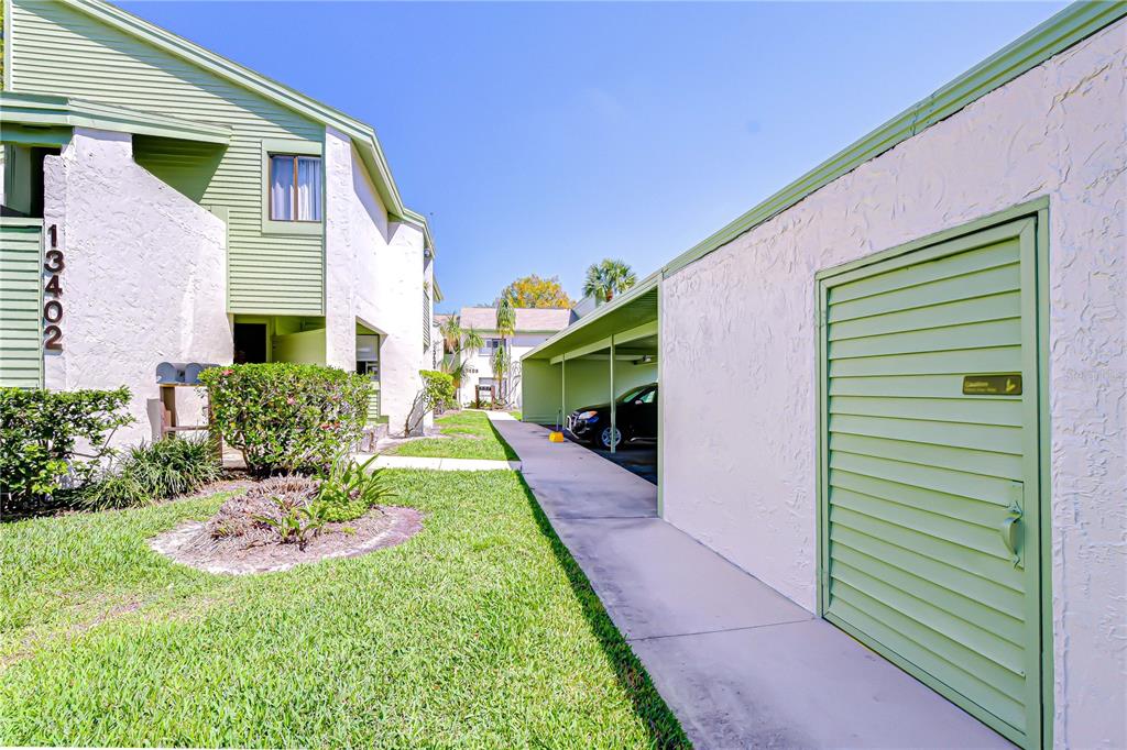 13402 Pinelake Way, Unit 202B Tampa, FL 33618 - Photo 35 of 42 a front view of a house with a yard