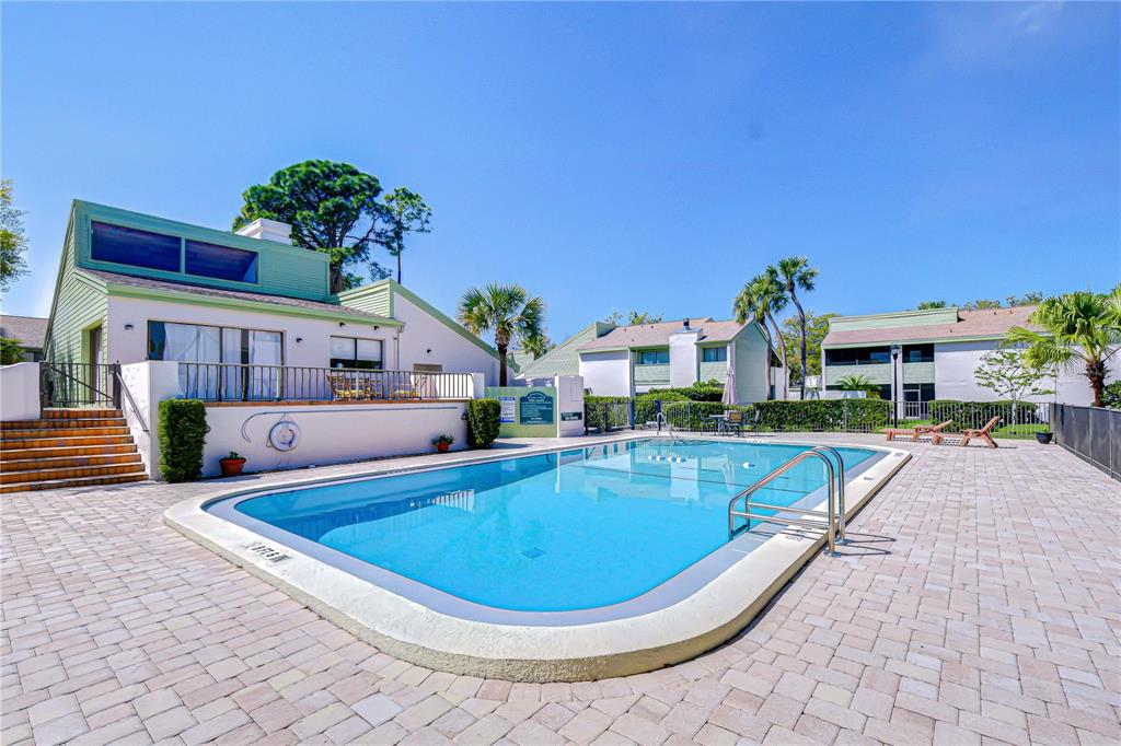 13402 Pinelake Way, Unit 202B Tampa, FL 33618 - Photo 37 of 42 a view of a house with swimming pool and sitting area