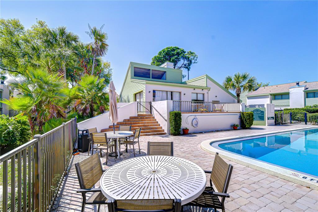 13402 Pinelake Way, Unit 202B Tampa, FL 33618 - Photo 38 of 42 a view of a house with swimming pool and sitting area