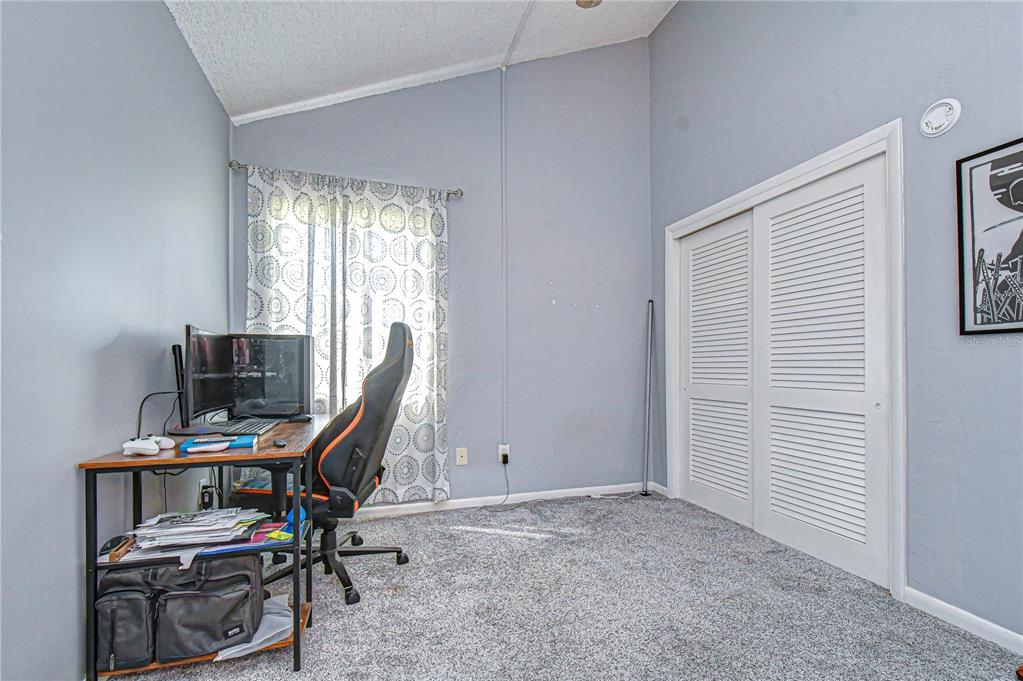 13402 Pinelake Way, Unit 202B Tampa, FL 33618 - Photo 8 of 42 a view of a workspace with furniture and a window