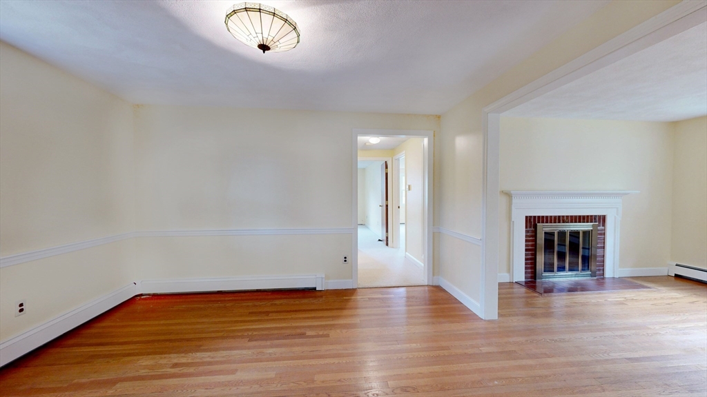 70 Old Nahant Road Wakefield, MA 01880 - Photo 11 of 42 a view of an empty room with wooden floor and a window