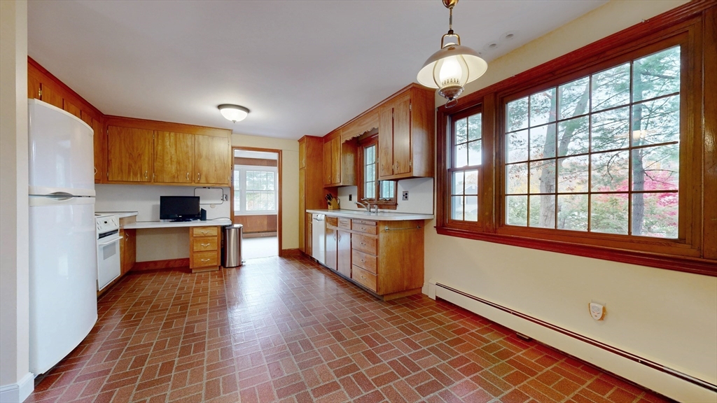 70 Old Nahant Road Wakefield, MA 01880 - Photo 14 of 42 a kitchen with stainless steel appliances granite countertop a stove and a sink