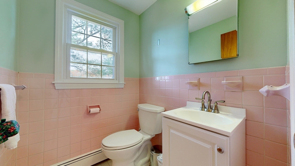 70 Old Nahant Road Wakefield, MA 01880 - Photo 22 of 42 a bathroom with a toilet sink and mirror