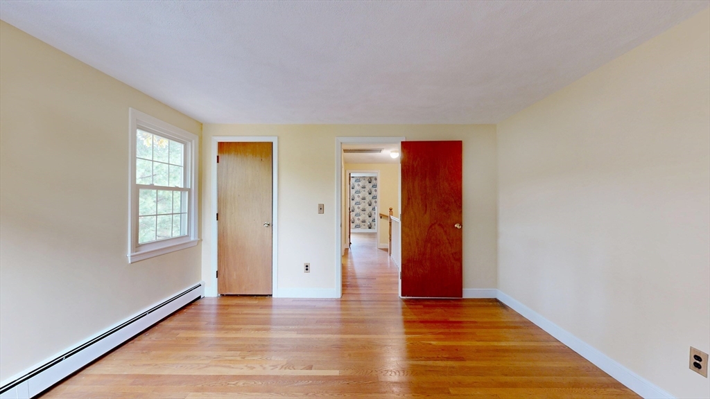 70 Old Nahant Road Wakefield, MA 01880 - Photo 26 of 42 a view of an empty room with window and wooden floor