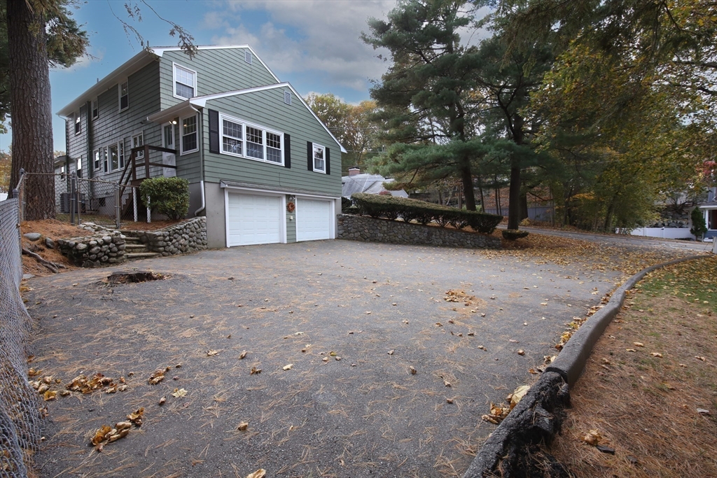 70 Old Nahant Road Wakefield, MA 01880 - Photo 40 of 42 a view of a house with a snow in the yard