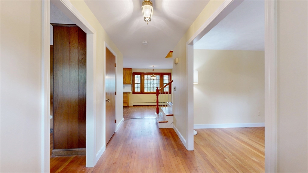 70 Old Nahant Road Wakefield, MA 01880 - Photo 5 of 42 a view of a hallway with wooden floor and staircase