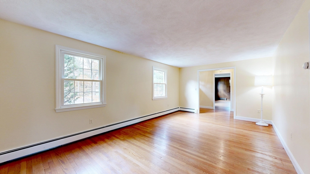 70 Old Nahant Road Wakefield, MA 01880 - Photo 8 of 42 an empty room with wooden floor and windows