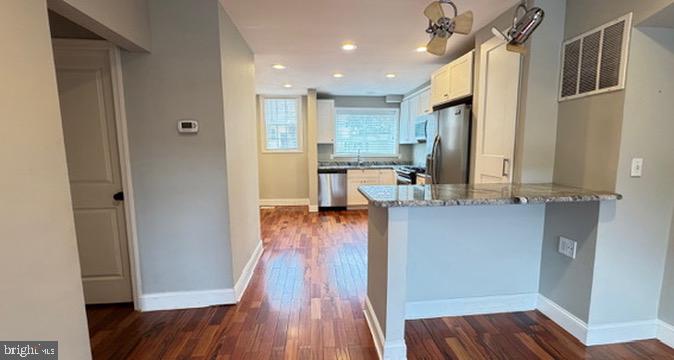 814 South Oak Street Arlington, VA 22204 - Photo 1 of 21 a view of a kitchen from the hallway