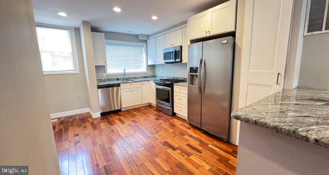 814 South Oak Street Arlington, VA 22204 - Photo 7 of 21 a kitchen with stainless steel appliances granite countertop a refrigerator and a sink