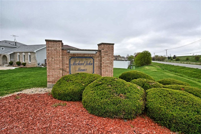 317 Wheatfield Road Matteson, IL 60443 - Photo 3 of 14 a building view with a garden space