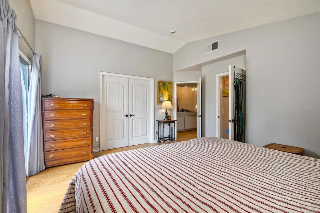 1208 Sunglow Drive Oceanside, CA 92056 - Photo 11 of 20 a bedroom with a bed and a mirror