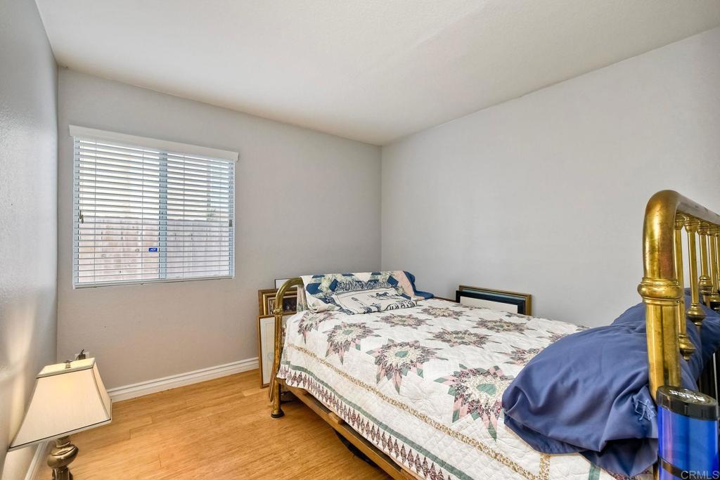 1208 Sunglow Drive Oceanside, CA 92056 - Photo 13 of 20 a bedroom with a bed and a window