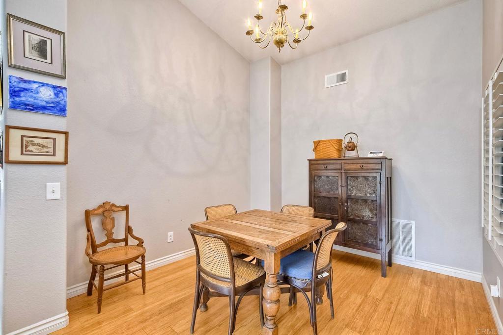 1208 Sunglow Drive Oceanside, CA 92056 - Photo 3 of 20 a view of a dining room with furniture and wooden floor