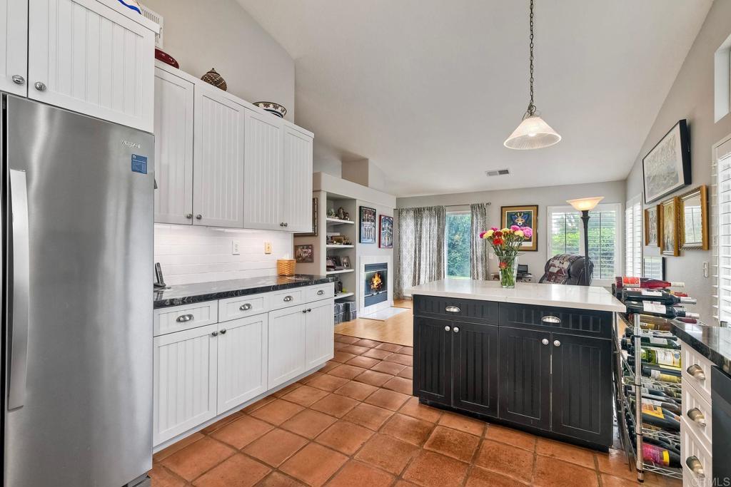 1208 Sunglow Drive Oceanside, CA 92056 - Photo 8 of 20 a kitchen with stainless steel appliances granite countertop a refrigerator and a sink