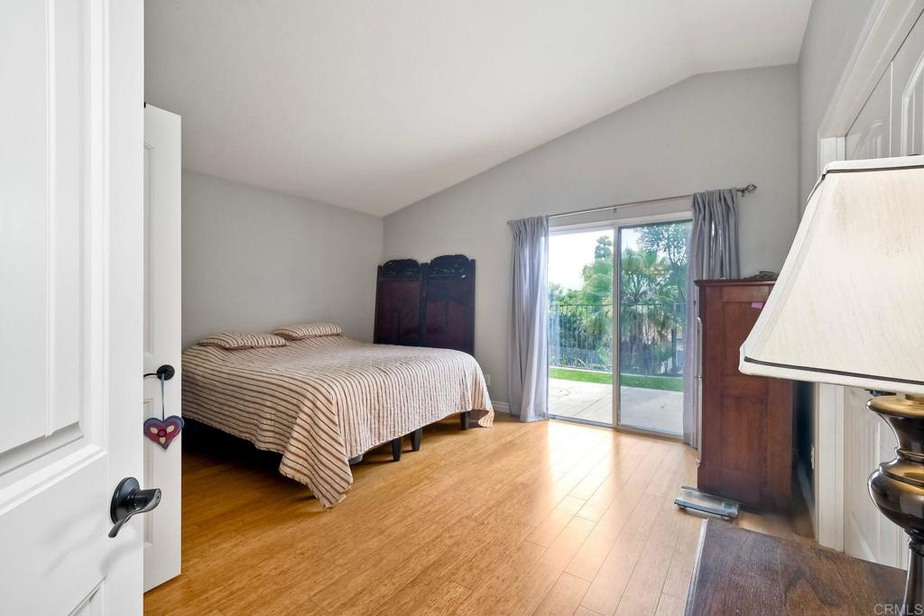1208 Sunglow Drive Oceanside, CA 92056 - Photo 10 of 20 a bedroom with a bed and a large window