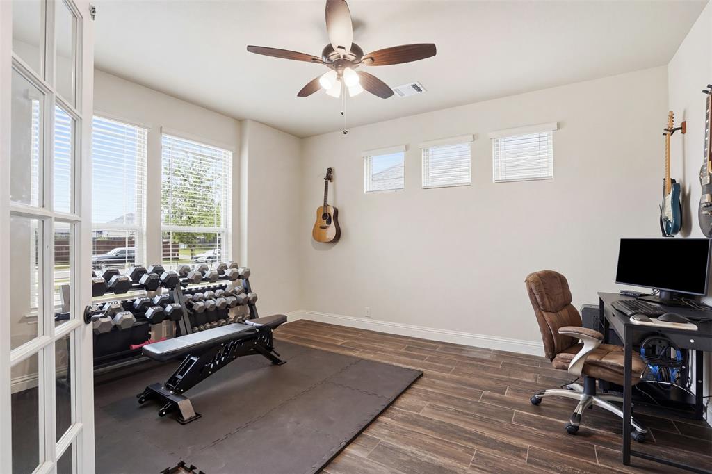 4002 Grove Valley Road Midlothian, TX 76065 - Photo 6 of 40 a view of a workspace with furniture and a window