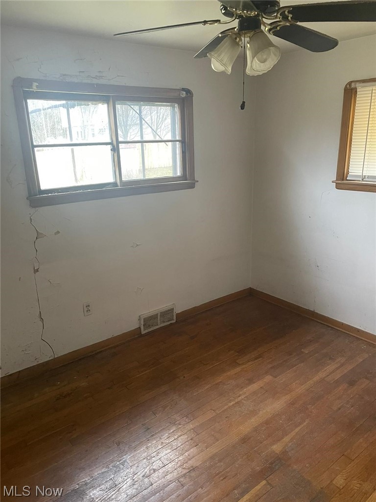 11153 Prospect Road Strongsville, OH 44149 - Photo 5 of 25 Unfurnished room with a wealth of natural light, ceiling fan, and wood-type flooring