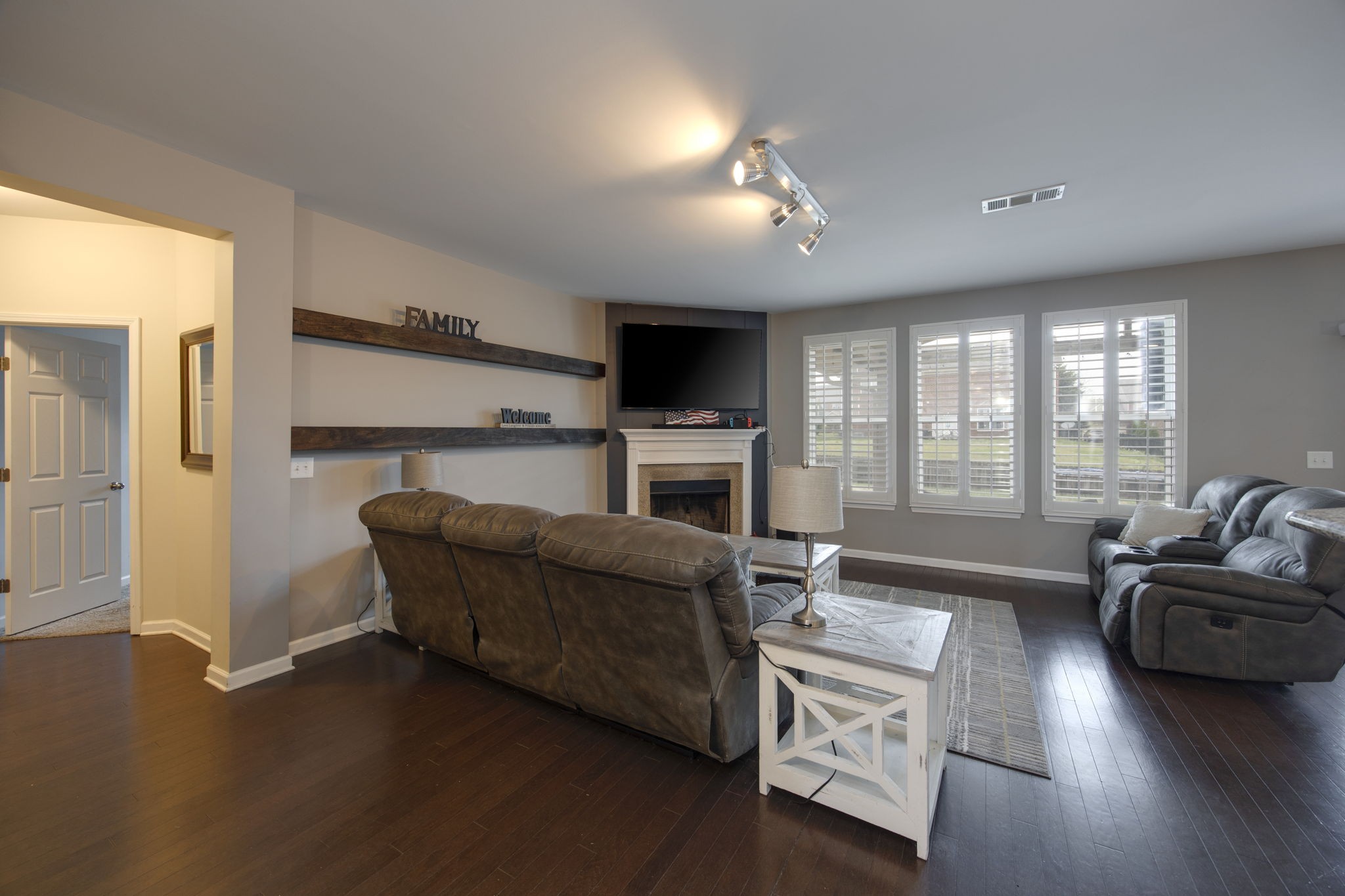 1014 Lacebark Lane Hendersonville, TN 37075 - Photo 16 of 69 a living room with furniture a flat screen tv and a fireplace