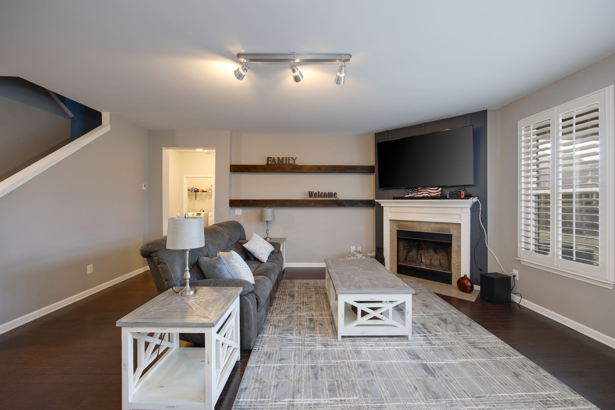 1014 Lacebark Lane Hendersonville, TN 37075 - Photo 18 of 69 a living room with furniture a flat screen tv and a fireplace