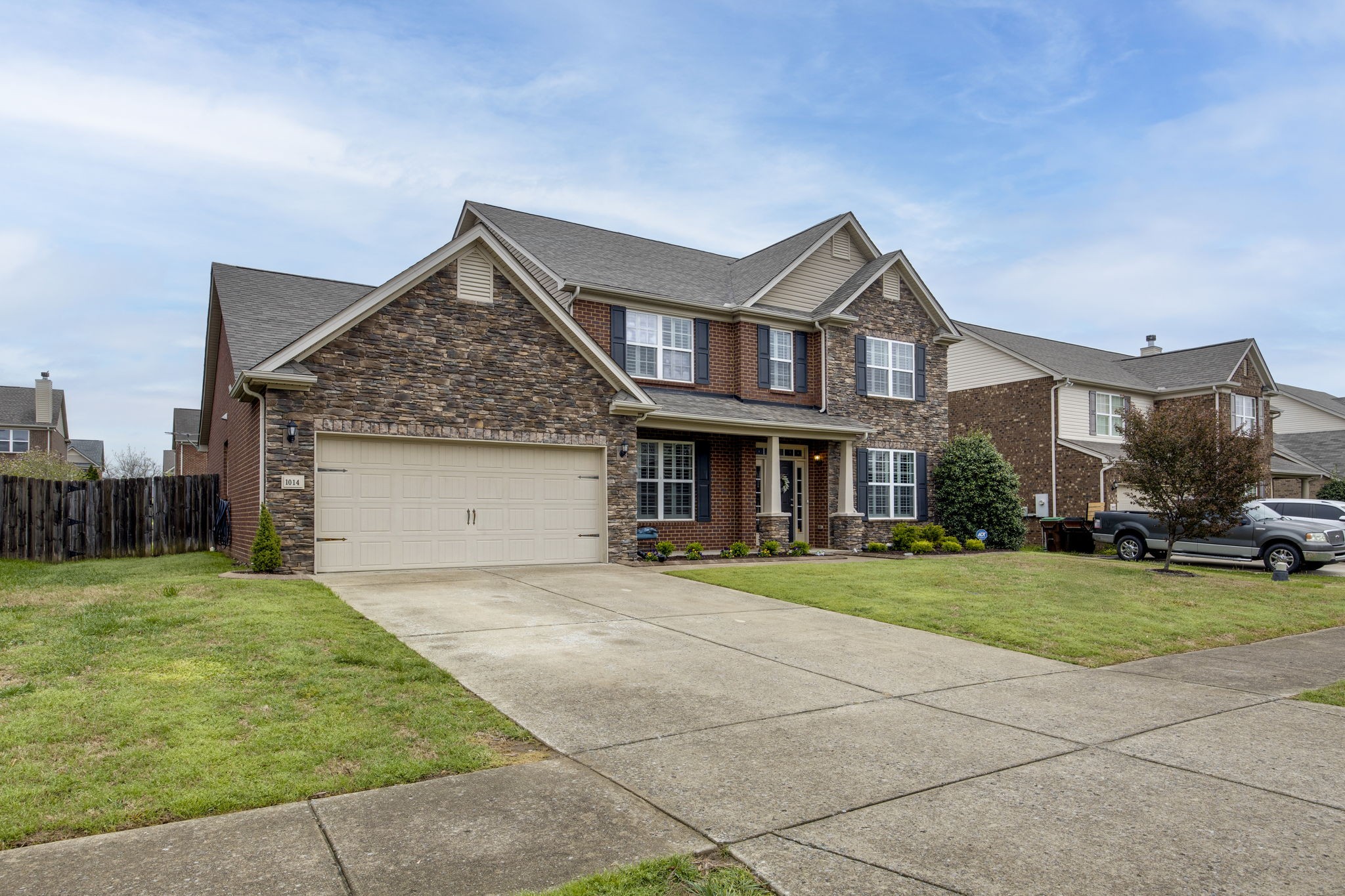 1014 Lacebark Lane Hendersonville, TN 37075 - Photo 64 of 69 a front view of a house with a yard and garage