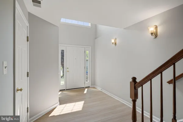 a view of entryway with wooden floor