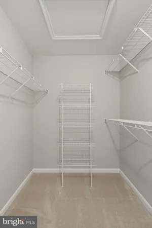 a view of an empty room with racks on the wall