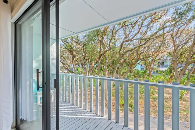 a view of a balcony with wooden floor
