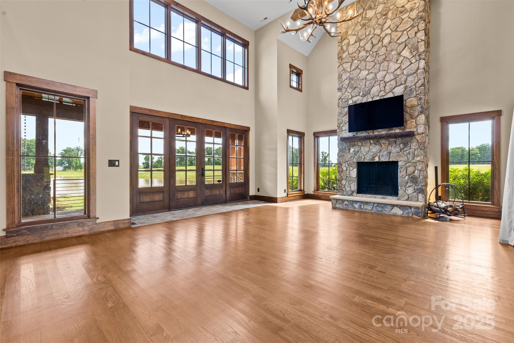 1822 Irby Road Monroe, NC 28112 - Photo 11 of 42 a view of an empty room with wooden floor fireplace and a window