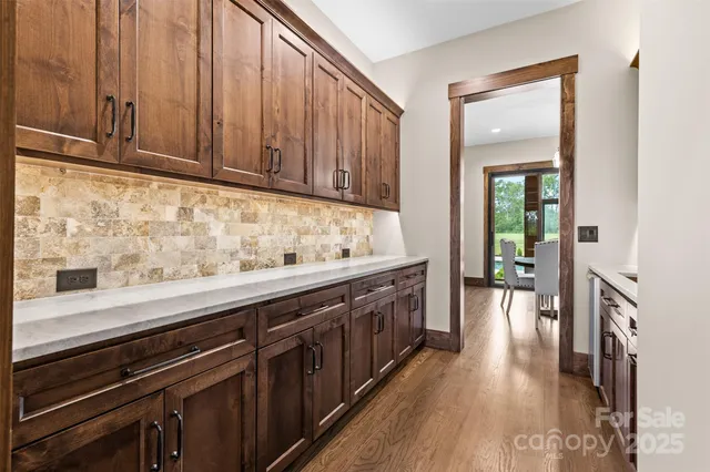 a kitchen with stainless steel appliances granite countertop wooden cabinets a sink and dishwasher