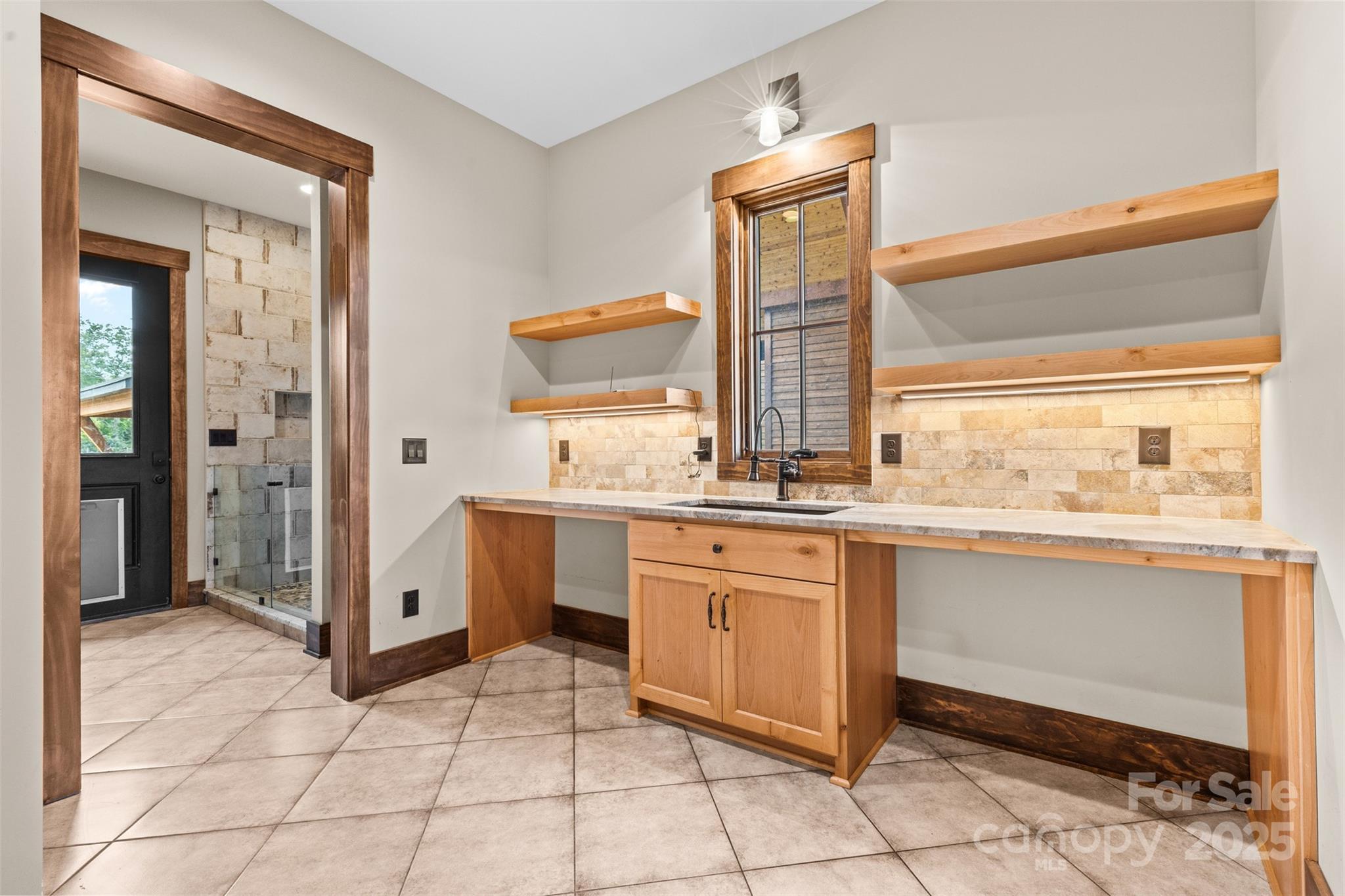 1822 Irby Road Monroe, NC 28112 - Photo 16 of 42 a spacious bathroom with a granite countertop sink and a mirror