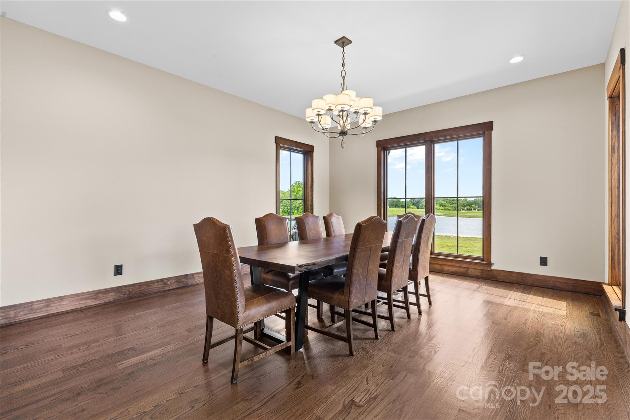 1822 Irby Road Monroe, NC 28112 - Photo 19 of 42 a view of a dining room with furniture a chandelier and wooden floor