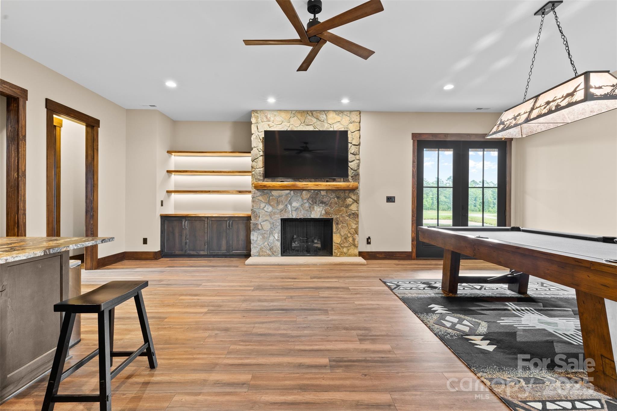 1822 Irby Road Monroe, NC 28112 - Photo 28 of 42 a living room with a fireplace furniture and a flat screen tv