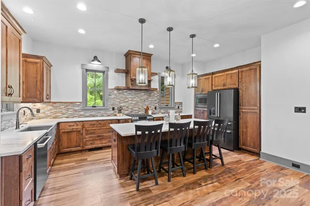 a large kitchen with a table and chairs