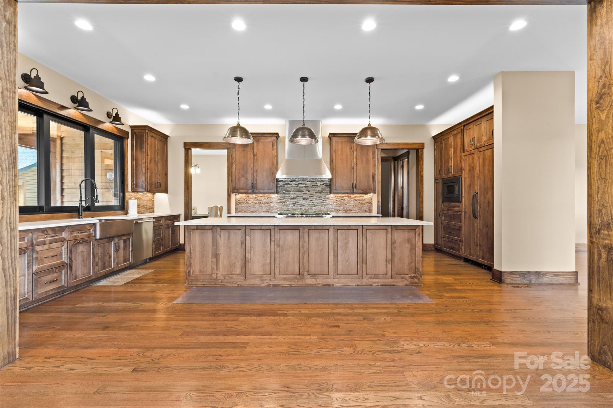 1822 Irby Road Monroe, NC 28112 - Photo 5 of 42 a large kitchen with stainless steel appliances kitchen island granite countertop a large counter top and stove
