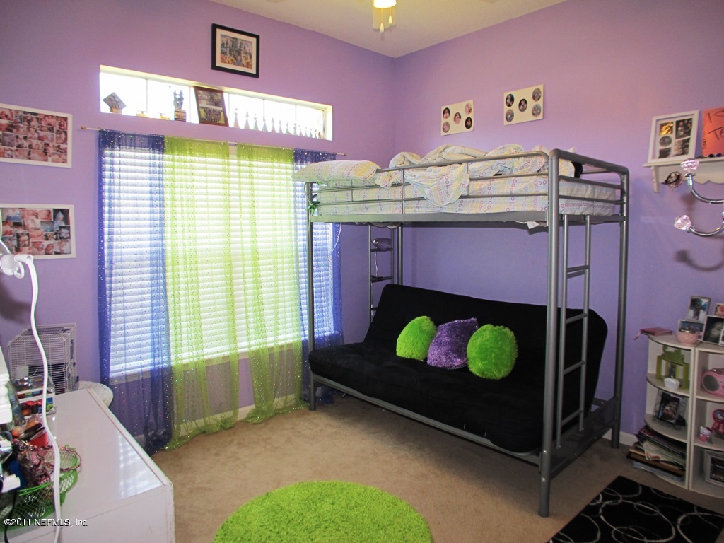 55254 Deer Run Road Callahan, FL 32011 - Photo 16 of 22 a bedroom with a bed and a window