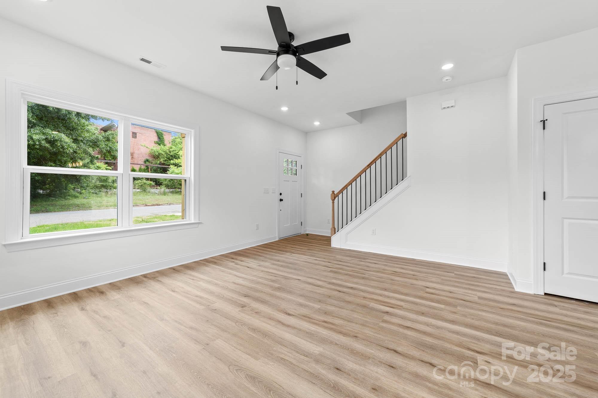 424 Airline Extension Shelby, NC 28150 - Photo 14 of 35 a view of an empty room with wooden floor and a window