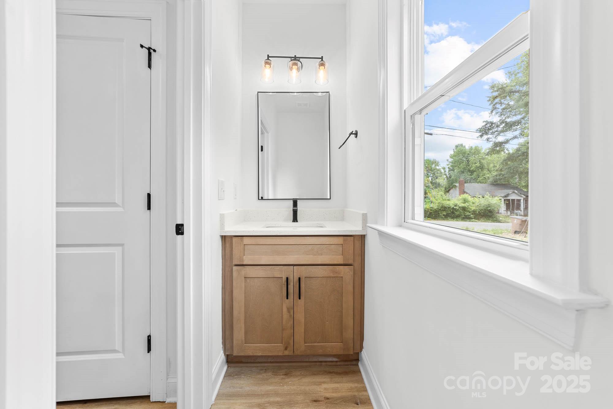 424 Airline Extension Shelby, NC 28150 - Photo 16 of 35 a bathroom with a sink a mirror and a window