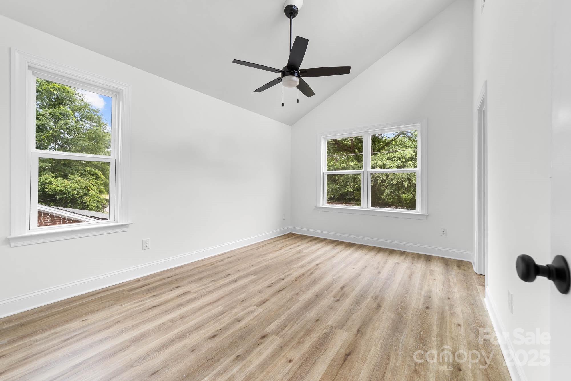 424 Airline Extension Shelby, NC 28150 - Photo 20 of 35 a view of empty room with wooden floor and fan