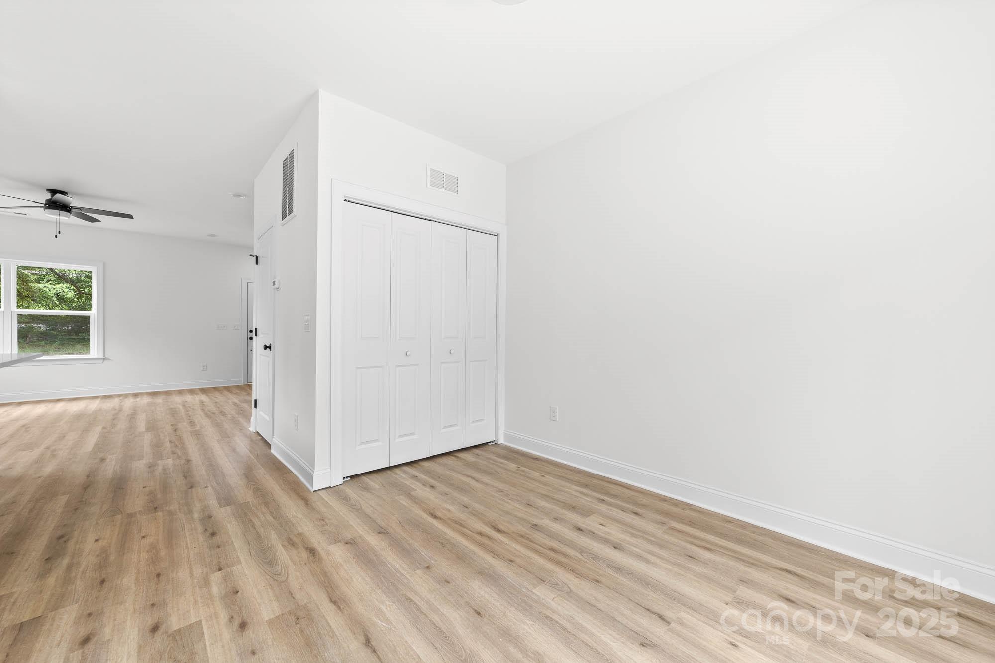 424 Airline Extension Shelby, NC 28150 - Photo 21 of 35 an empty room with wooden floor and windows