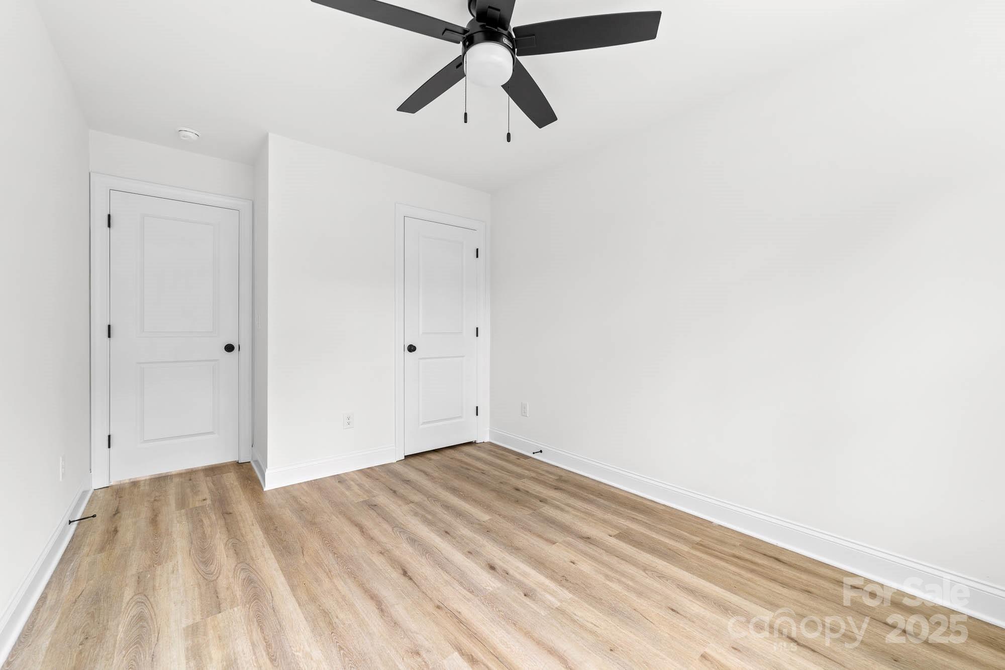 424 Airline Extension Shelby, NC 28150 - Photo 22 of 35 a view of empty room with wooden floor and ceiling fan