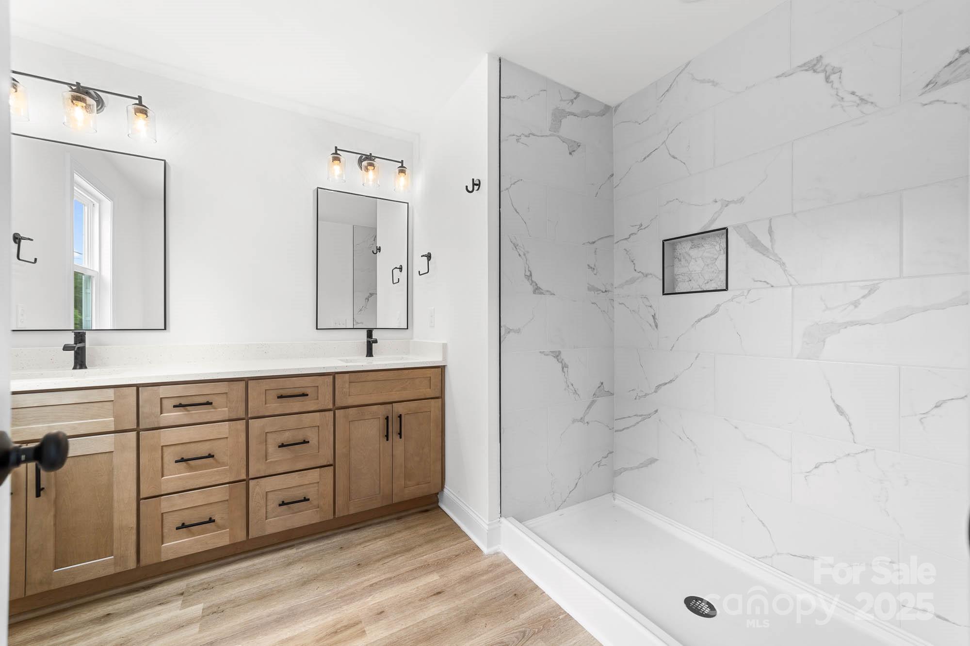 424 Airline Extension Shelby, NC 28150 - Photo 27 of 35 a spacious bathroom with double vanity a sink a mirror a bathtub and shower