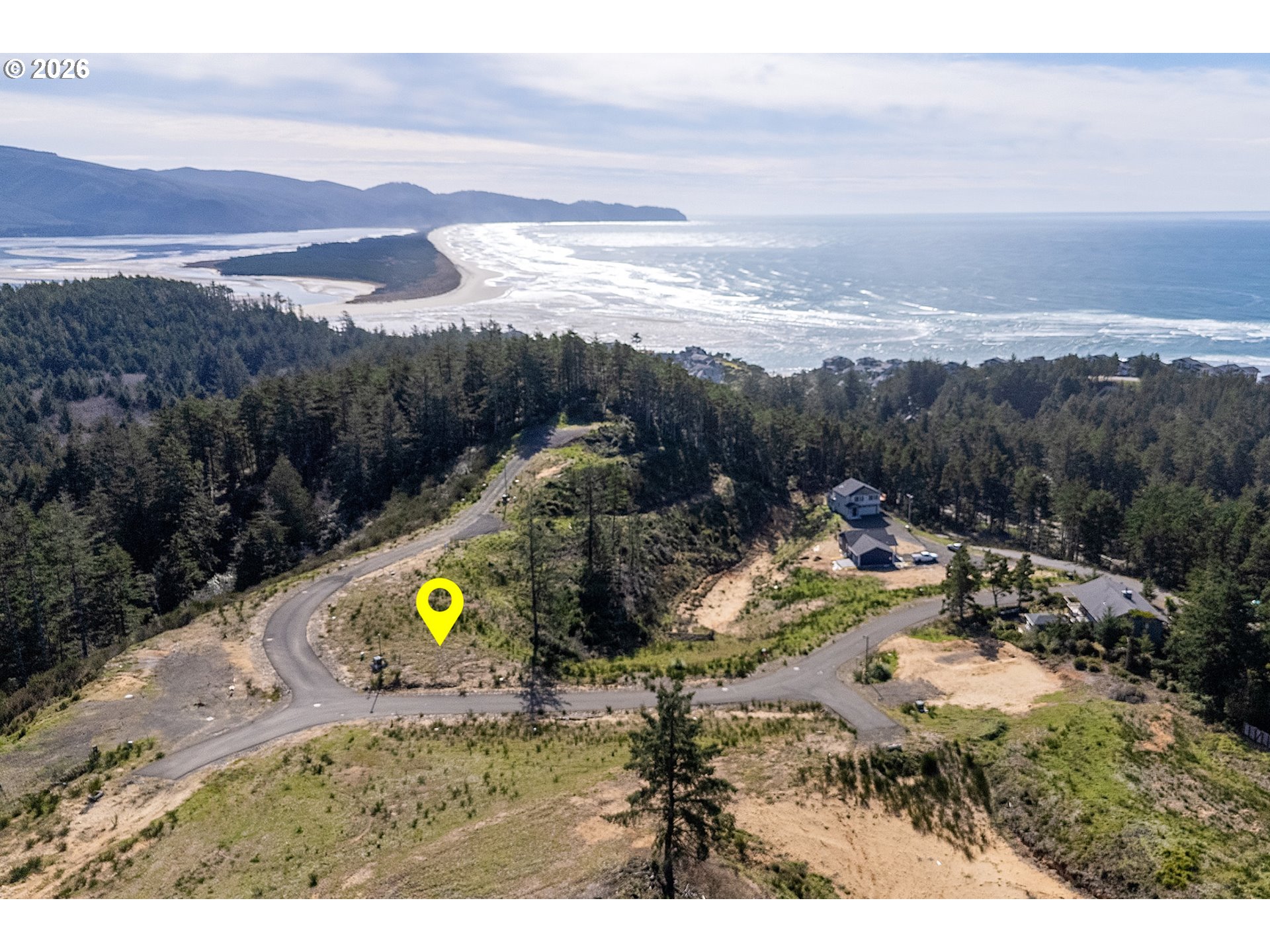 Roaring Tide Street, Unit 5 5 Tillamook, OR 97141 - Photo 3 of 10 a view of a lake with a mountain