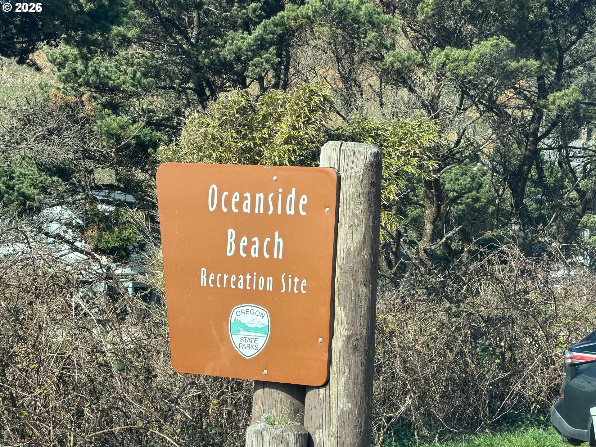 Roaring Tide Street, Unit 5 5 Tillamook, OR 97141 - Photo 8 of 10 a sign that is on the side of the road