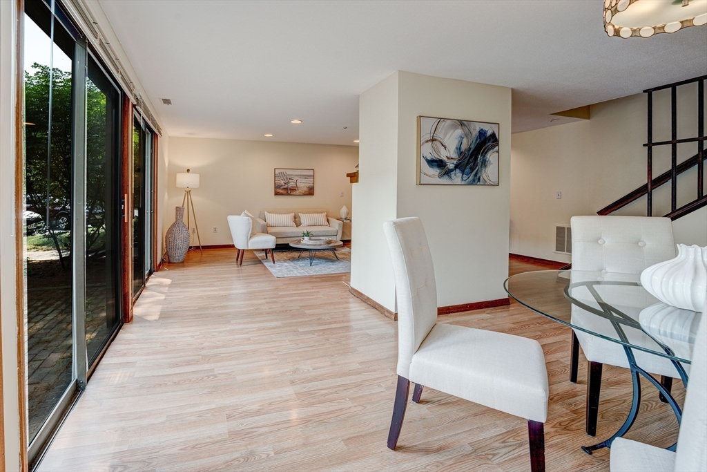 244 Old Beaverbrook, Unit 244 Acton, MA 01718 - Photo 11 of 42 a living room with furniture and a wooden floor