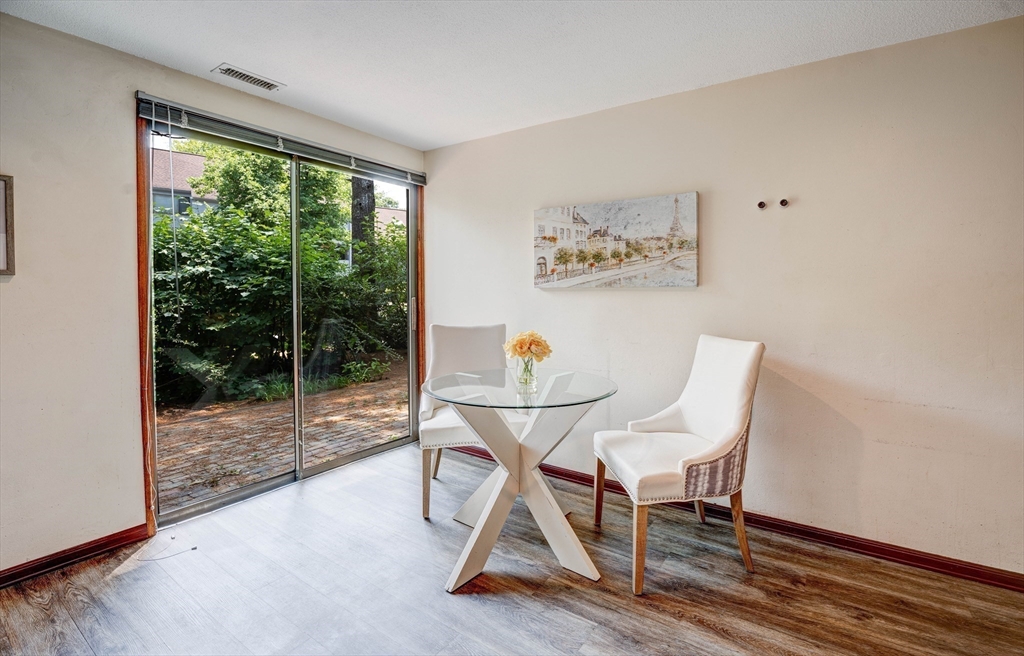 244 Old Beaverbrook, Unit 244 Acton, MA 01718 - Photo 14 of 42 a view of a livingroom with furniture wooden floor and a window