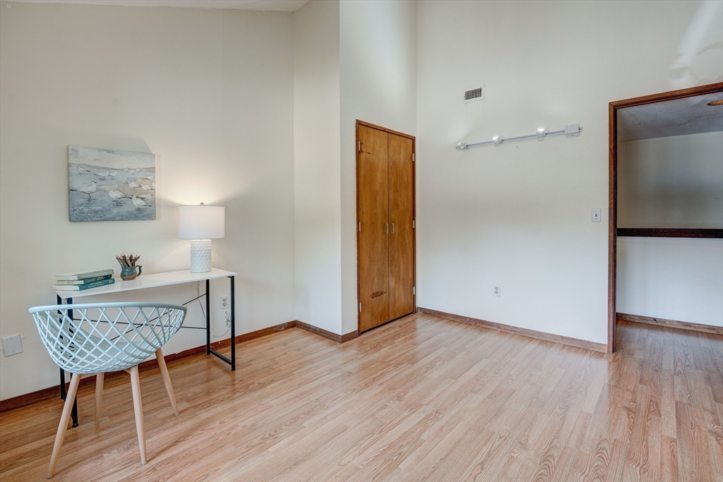 244 Old Beaverbrook, Unit 244 Acton, MA 01718 - Photo 25 of 42 a view of room with furniture and wooden floor